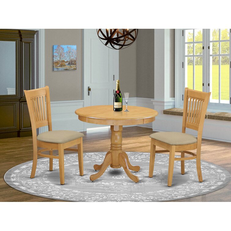 Solid oak oval discount dining table and chairs